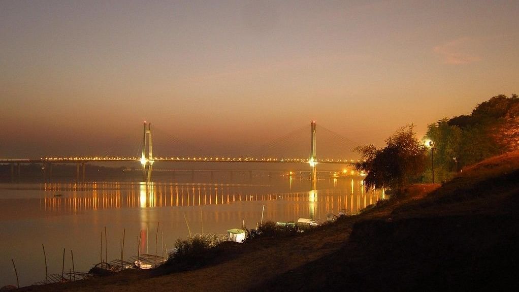 A beautiful river view and and the bridge with lights.