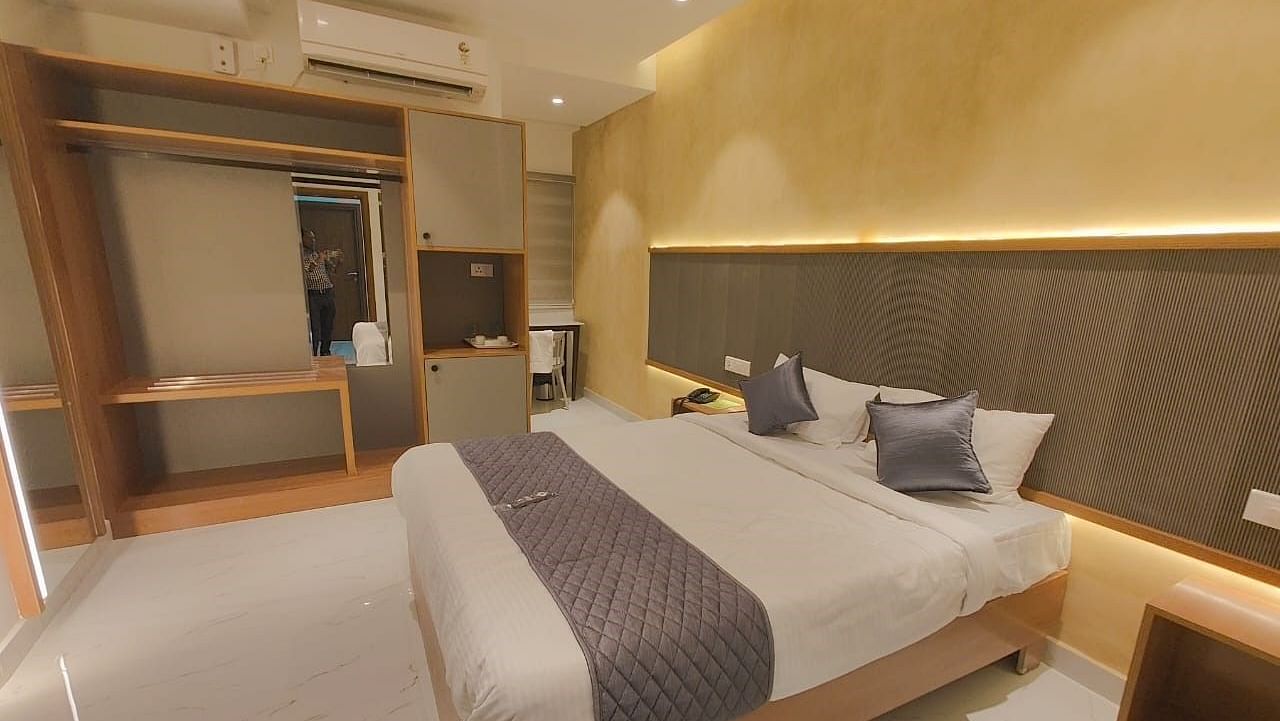 a view of the king sized bed of the room at Hotel La Premier