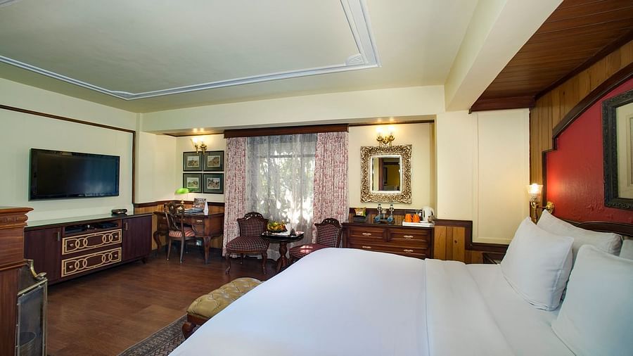 a king size bed facing the TV - Mayfair Hill Resort, Darjeeling