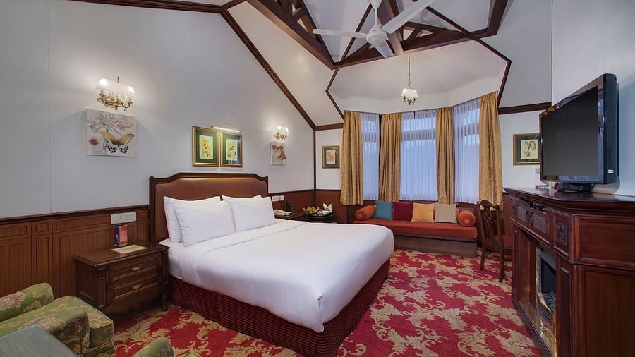 a king size bed facing the TV - Mayfair Hill Resort, Darjeeling