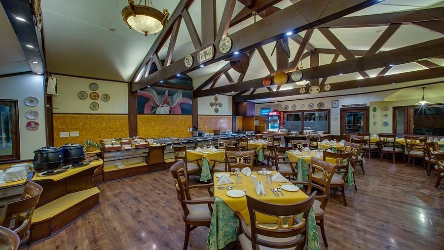 indoor seating space at the restaurant - Mayfair Hill Resort, Darjeeling 5