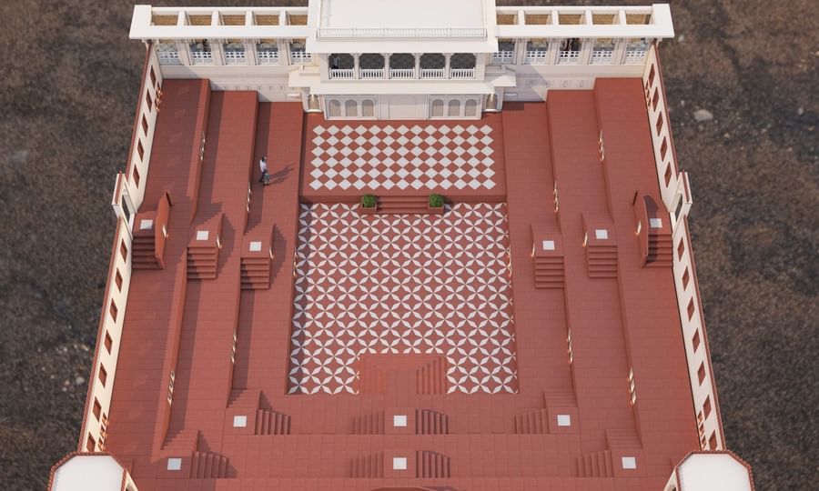 Umaid Palace courtyard with red steps and patterned red and white floor.