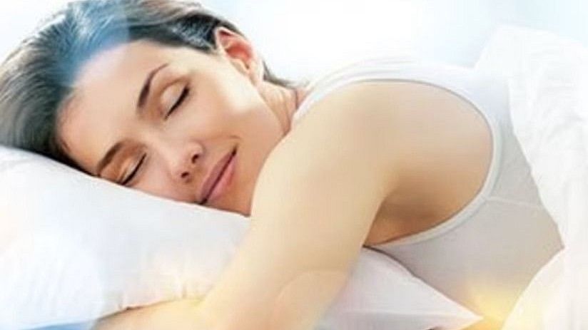 A peaceful image of a woman sleeping comfortably, promoting the sleep therapy programs at YO1, Catskills, New York.