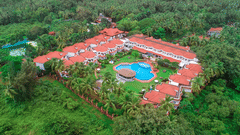 Facade view with surrounding nature at Heritage Village Resorts and Spa, Goa - a Boutique Beach Resort in South Goa.