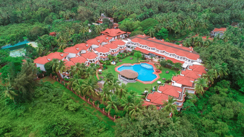 Facade view with surrounding nature at Heritage Village Resorts and Spa, Goa - a Boutique Beach Resort in South Goa.
