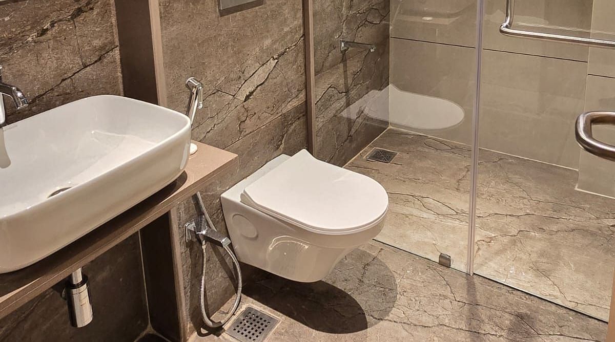 Bathroom featuring a wash basin and shower space at Hotel Mumbai House, Vashi.
