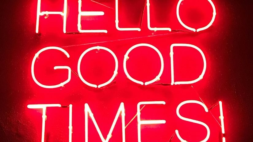 A flashy signboard outside of a bar