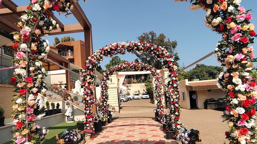 Entrance designed with flower gates and floral mat is placed leading to a wedding hall at The Grand Legacy Resort & Spa