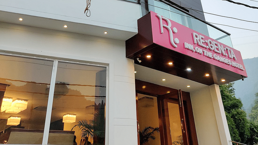 The exterior of Regenta In DLS taken from a lower angle featuring the entrance of our hotel.