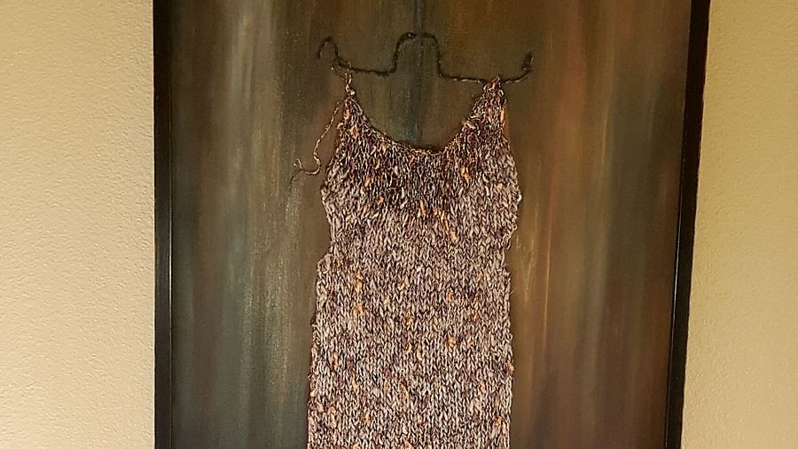 A stylish framed dress art piece adding character to our room - Brewery Gulch Inn & Spa