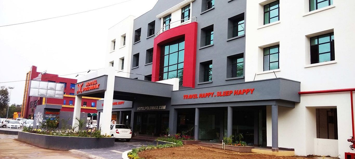 facade image of our hotel in Jabalpur taken on a bright cloudy day - Max Hotel, Jabalpur