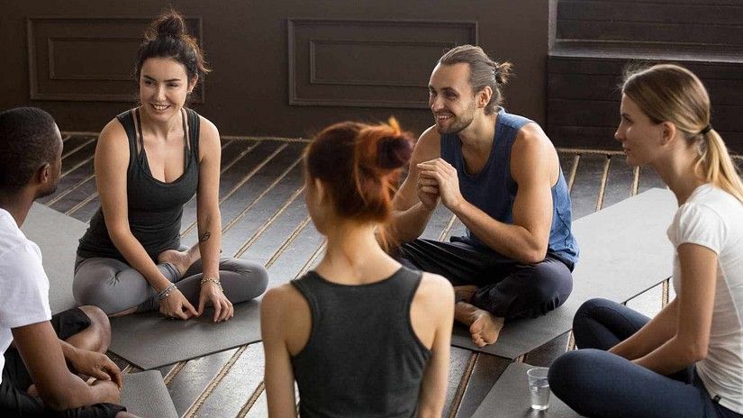A group of people immersed in discussion at YO1 Health Resort  Wellness Retreat Near NYC