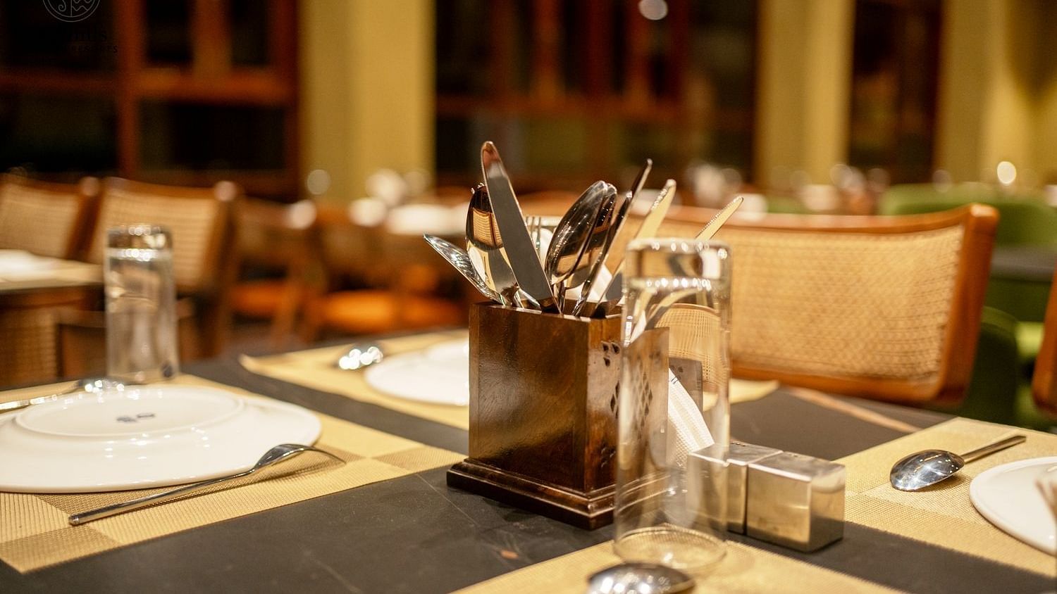 A close-up of a dining table setting with cutlery and glassware - Sea Hills Resort, Swaraj Dweep (Havelock)