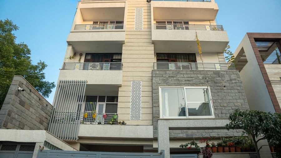 Exterior view of the modern multi-storey homestay building showcasing its contemporary design at Jaypore360 Homestay.
