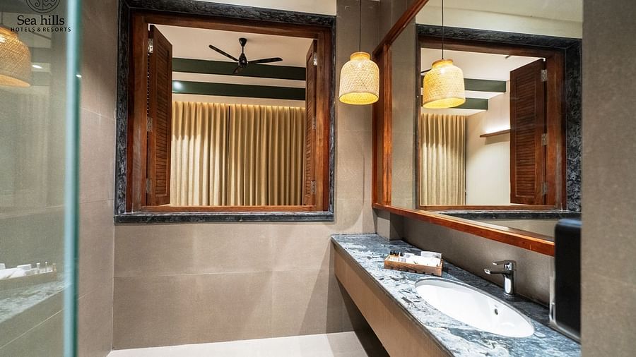Contemporary bathroom with a , wooden accents, and a stylish vanity with a marble countertop - Sea Hills Resort, Swaraj Dweep (Havelock)