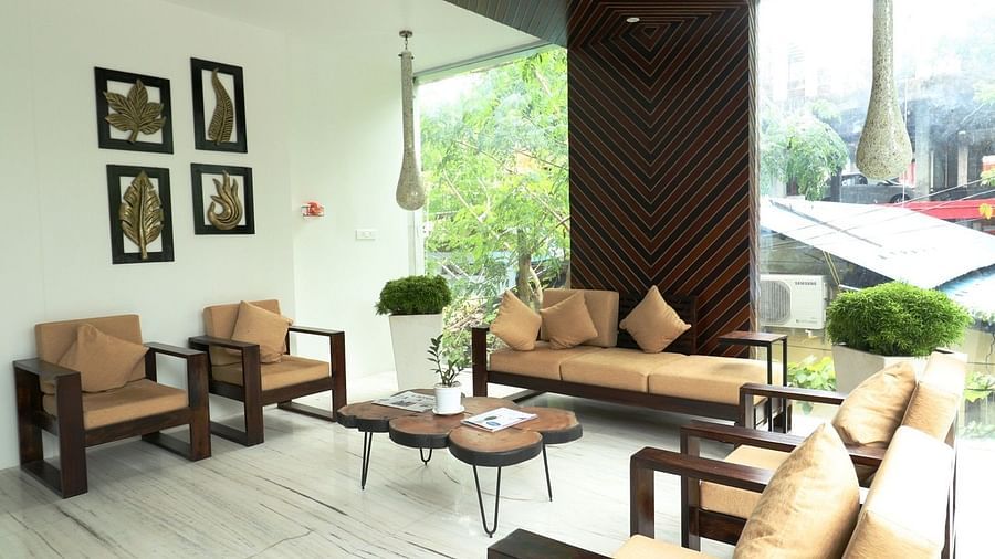 A bright, wide view of the hotel lobby or common area with multiple seating groups, showcasing the contemporary design and natural light - Sea Hills Hotels, Sri Vijaya Puram (Port Blair)