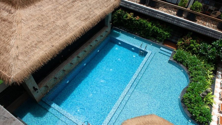 Full view of the swimming pool at The Evren, Vagator with the Splash Pool Bar beside it.