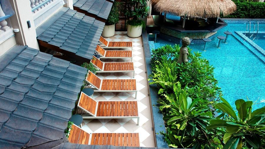 A top-angle shot of the sun loungers overlooking the calm swimming pool at The Evren, Vagator.
