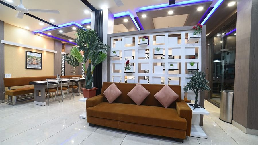 sofa in reception area at Hotel Panchvati Inn
