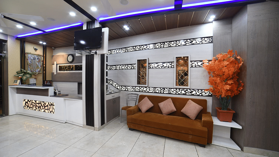 Sofa and the reception counter at Hotel Panchvati Inn