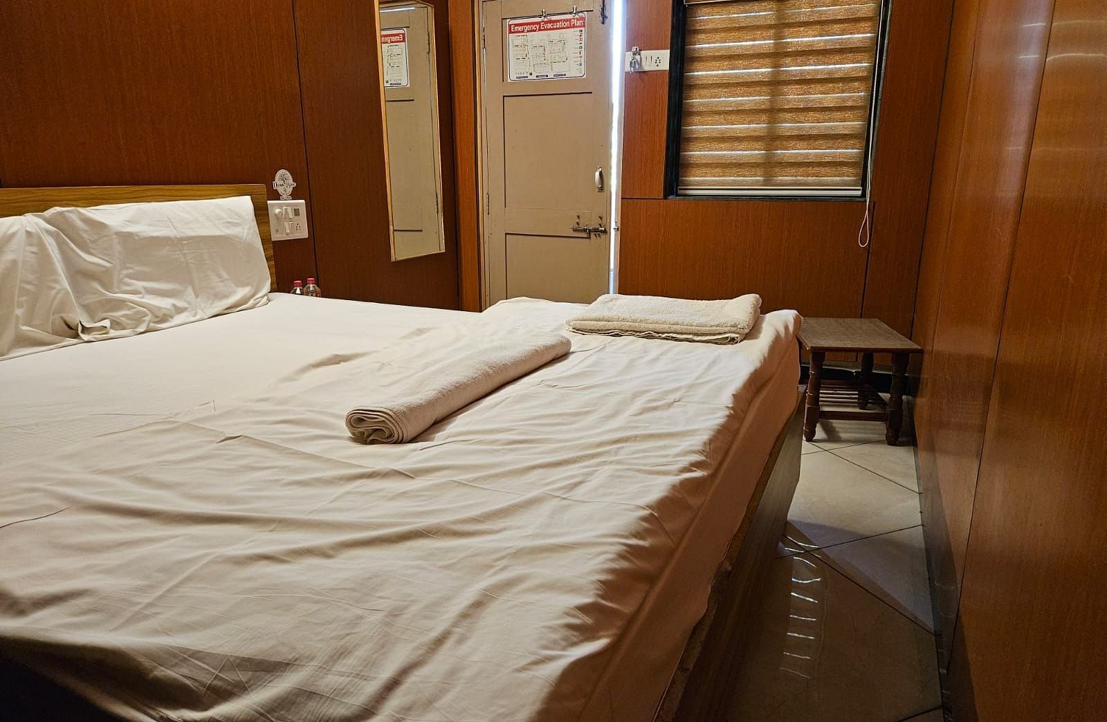 The entrance to the room overlooking the plush double bed with at the Dream Vision Guest House.