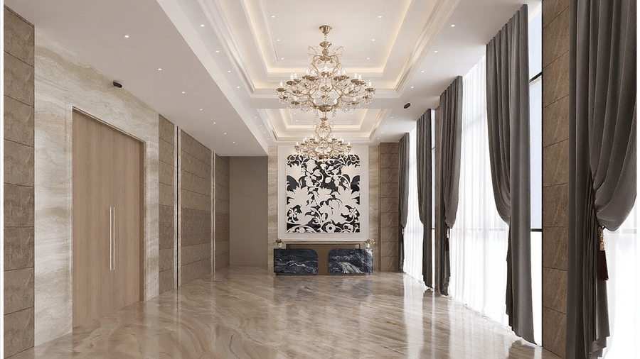 Front view of the banquet hall with ample of natural light coming from the ceiling-to-floor windows covered with thin white curtains at Essentia Luxury Hotel and Convention, Nagpur.