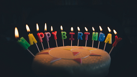 a cake with birthday candles lit