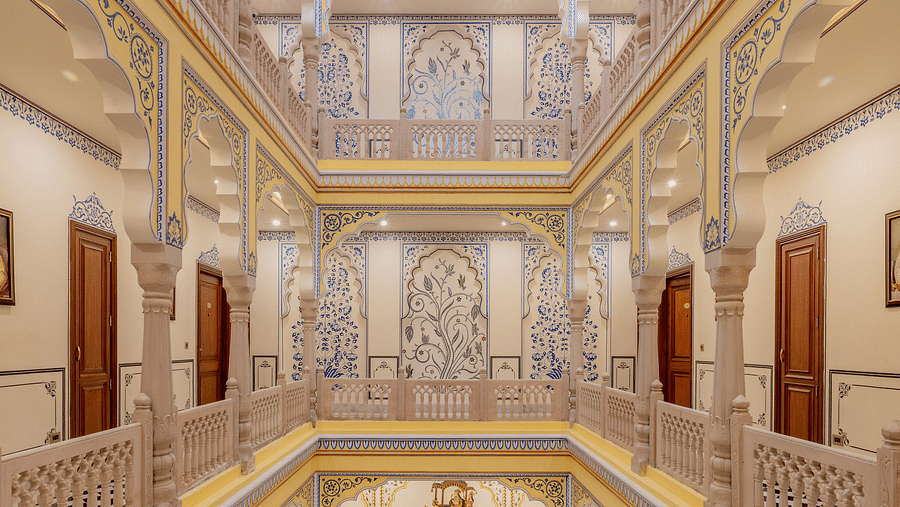 full view image of the corridor in the first floor with several wooden doors leading to various floors - Brij Castle, Jaipur