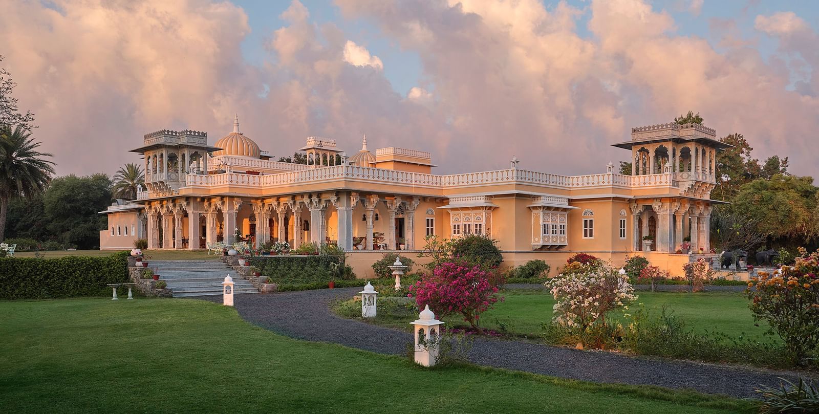 facade image of dev shree, deogarh with a picturesque sky with clouds in the background