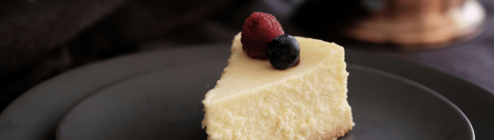 Slice of creamy cheesecake garnished with berries served at Kaldan Samudhra Palace.