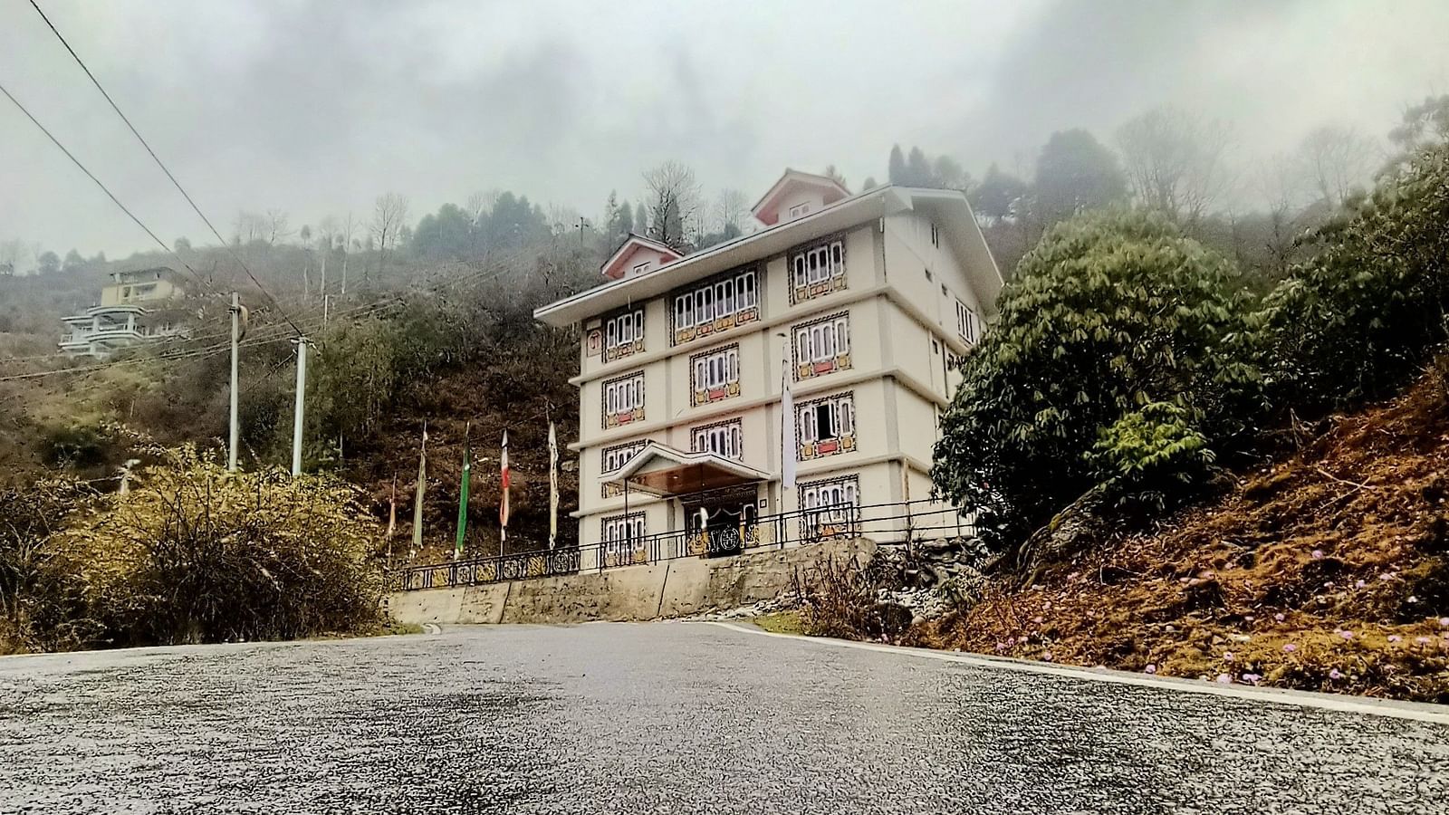Facade of Ecotel Sonam Lachung covered in mist