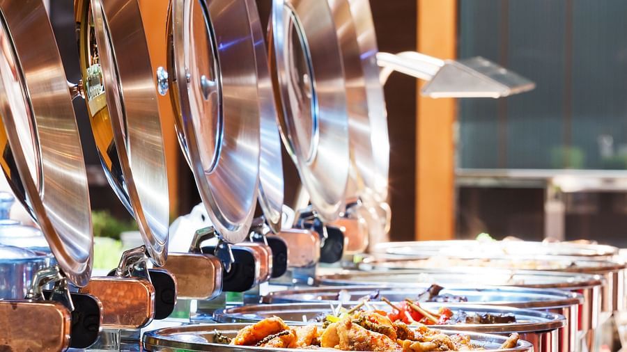 A close up shot of many items kept on trays during a Buffet - La Maison Hotel, Doha