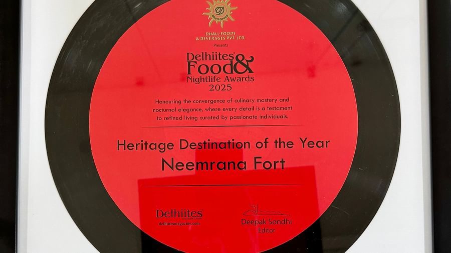 Framed award plaque for 'Heritage Destination of the Year 2025' awarded to Neemrana Fort by Delhiites Food & Nightlife Awards.