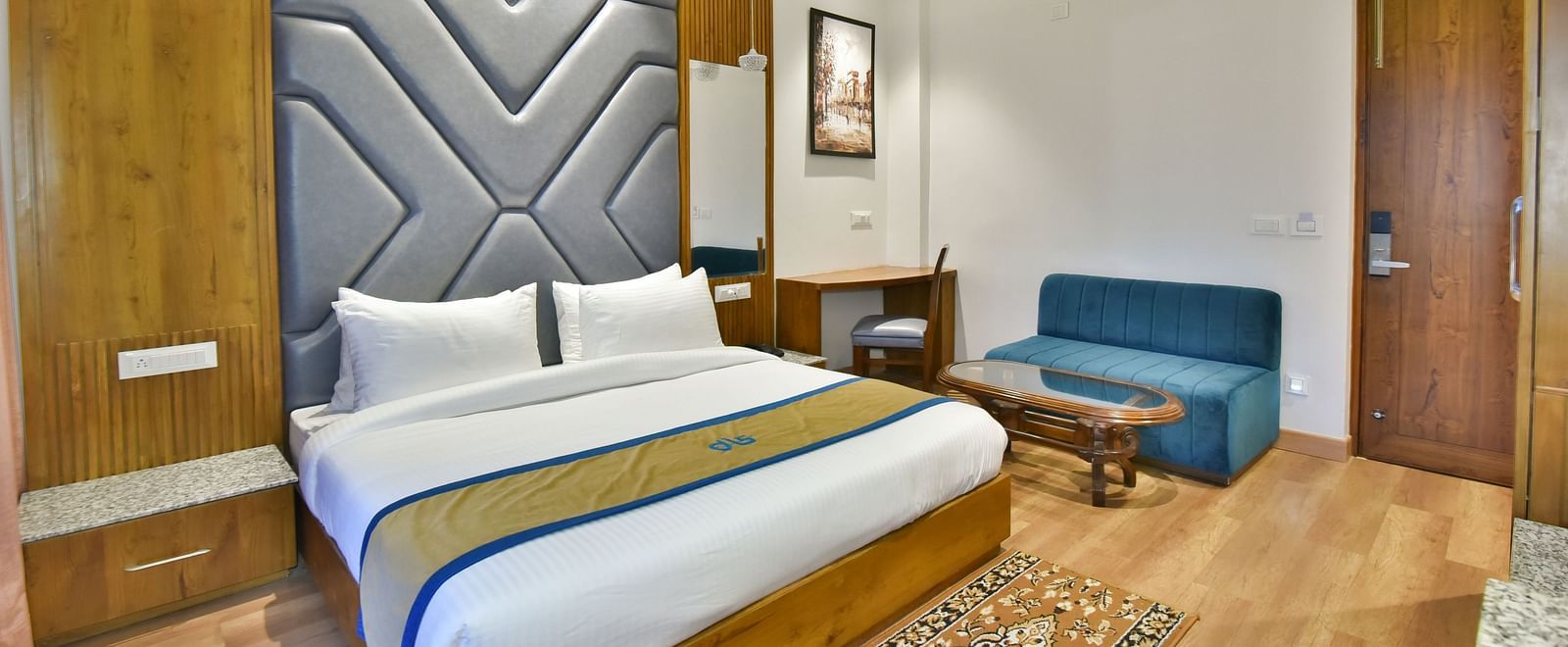 A large bed in Deluxe Non-view Room at DLS Ark Holiday Inn, Banikhet.