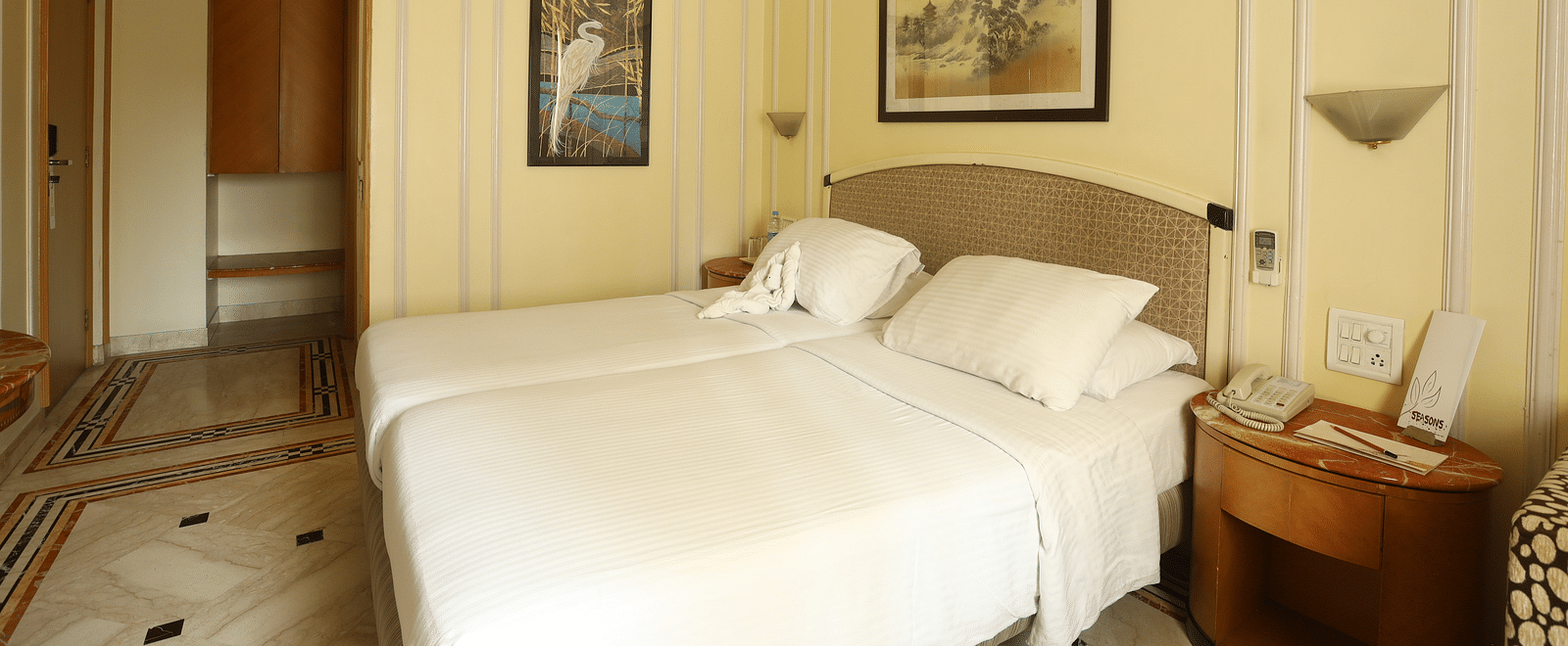 Twin beds in the Standard Room at Regency Hotel, Mumbai.
