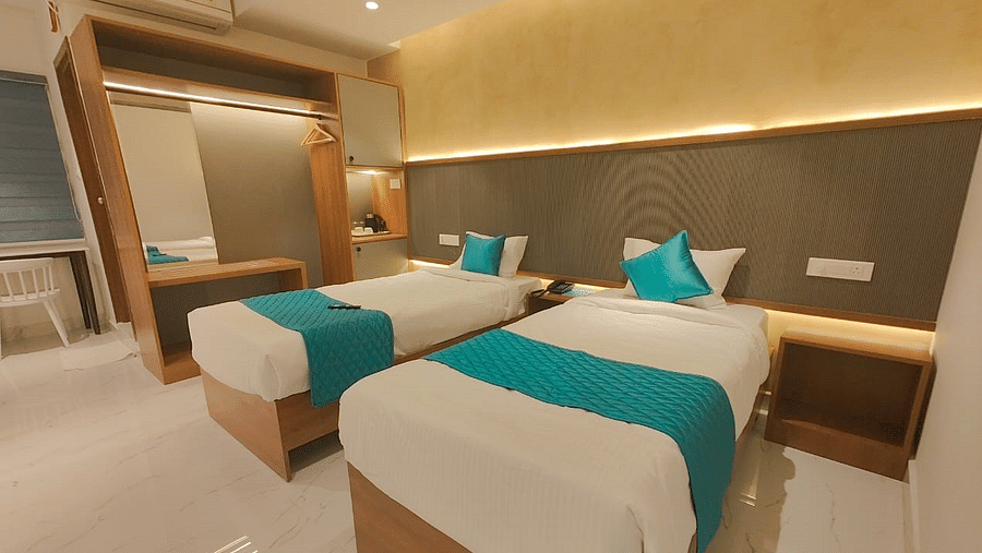 a view of the twin bed of the room at Hotel La Premier 