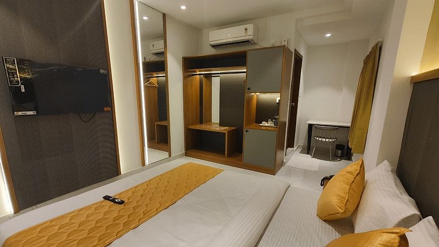 a view of the king sized bed of room at hotel La Premier 