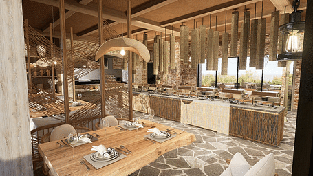 Diagonal view of the restaurant with neatly set tables and chairs, featuring a central table with a buffet setup at The Evren, Vagator.