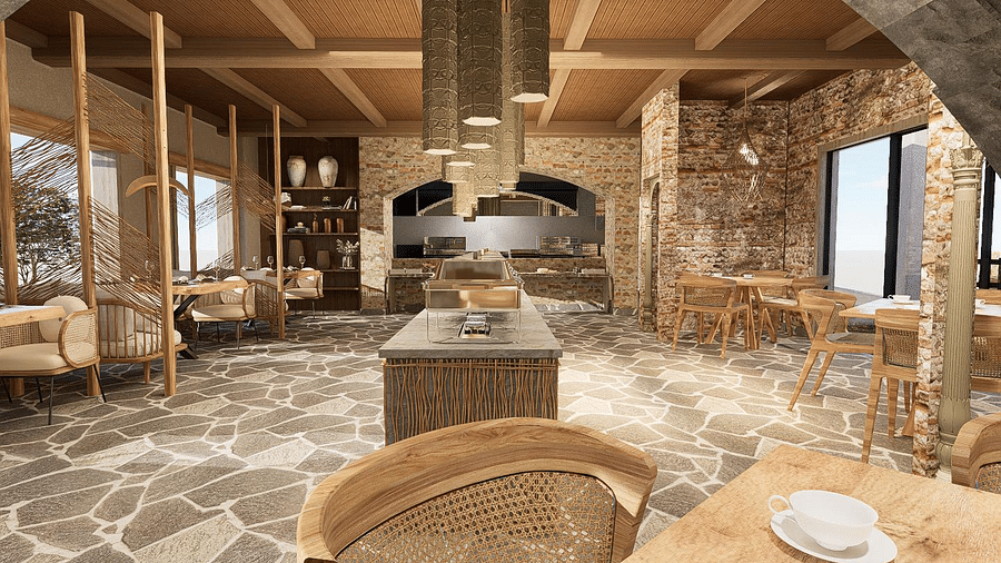 Cosy dining area with table and chair arrangements, highlighted by a ceiling-hung chandelier at The Evren, Vagator.