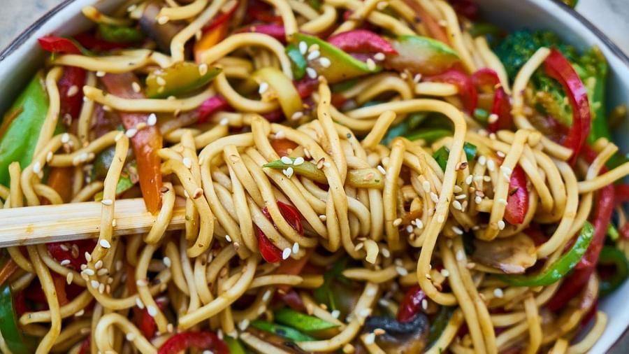 a close up shot of a noodle dish served inside the restaurant - Rhythm Gurugram