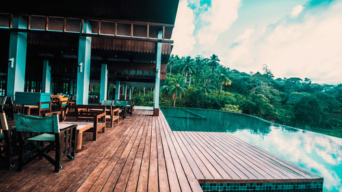 The deck by the infinity pool at the sunset lounge - Symphony Samudra Beachside Jungle Resort And Spa, Port Blair