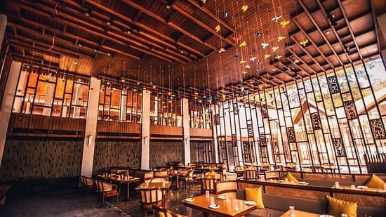 interior of the islander restaurant designed with wooden interior and inspired by the birds at Chidiya Tapu - Symphony Samudra Beachside Jungle Resort And Spa