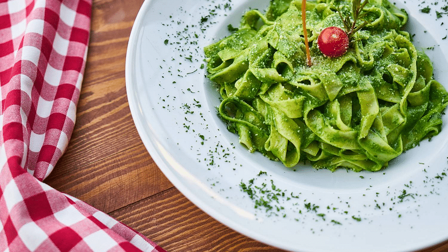 Canva - Flat Pasta Noodle With Green Sauce Dish and Cherry Tomato on Top zrhobp