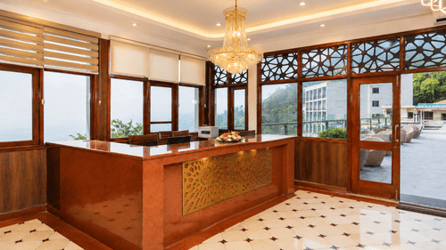 Warm and welcoming reception area with elegant décor at Pride Ashiyana Resort Mussoorie.