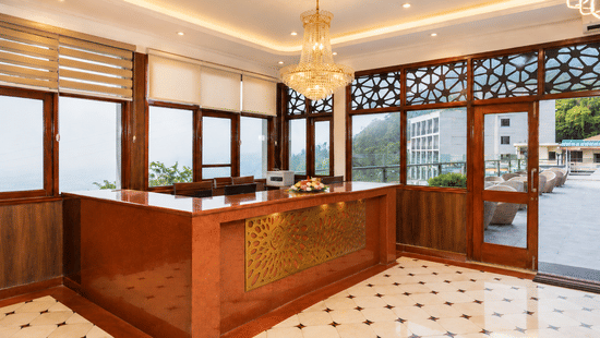 Warm and welcoming reception area with elegant décor at Pride Ashiyana Resort Mussoorie.