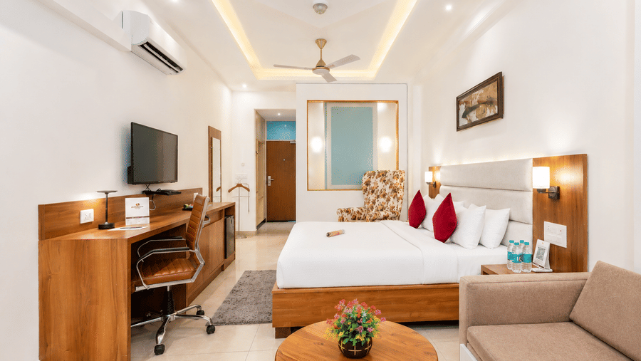 Luxury suite with seating area and refined interiors at Pride Ashiyana Resort Mussoorie.