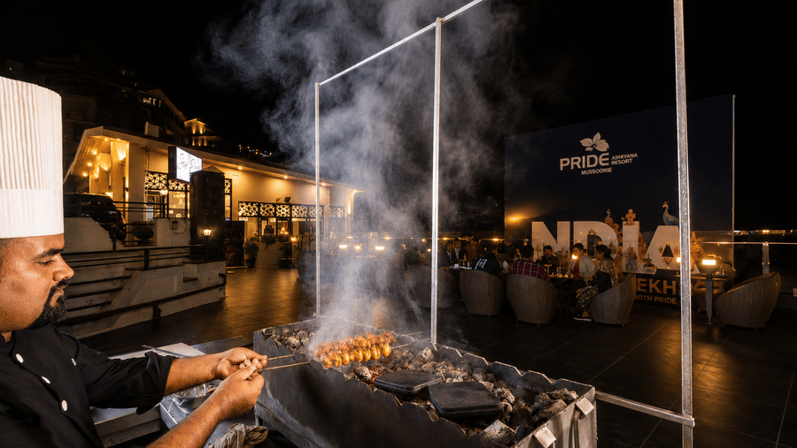 Live barbecue experience with chef preparing grilled delicacies at Pride Ashiyana Resort Mussoorie.