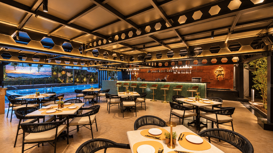 A cosy restaurant space with set dining tables at BluSalzz Collection - Casa Onze, Arpora.