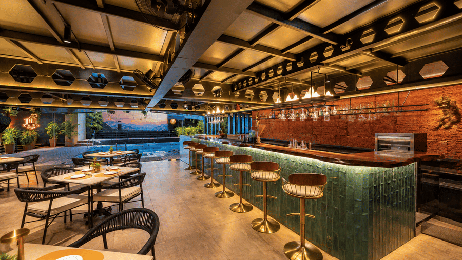 A cosy bar counter and indoor dining area at BluSalzz Collection - Casa Onze, Arpora near the pool.