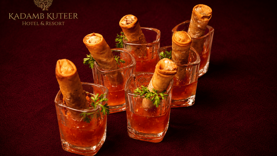 Assorted appetisers served in shooter glasses arranged on a tray at Kadamb Kuteer, Vrindavan.